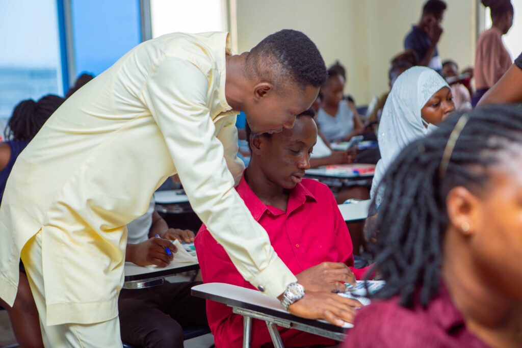 Salifu Abdul Rahman assisting some students through the download process